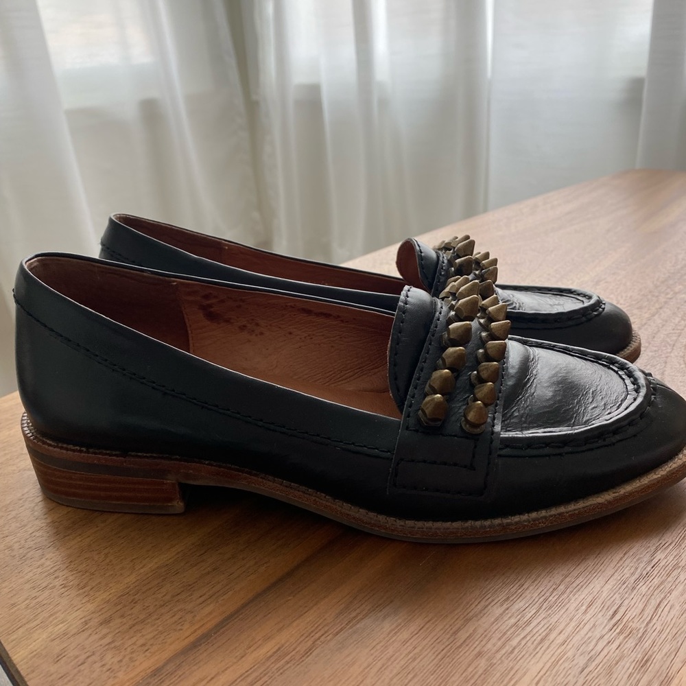 Jeffrey Campbell black leather loafer with brass spikes